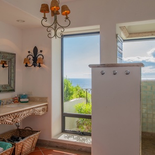 En suite bathroom with ocean views and walk in shower