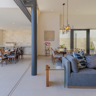 Unwind in your spacious open-plan living area where modern comfort meets sleek design, perfect for memorable gatherings.