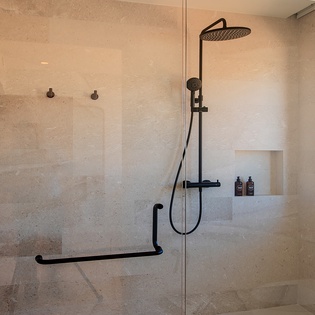 En suite bathroom with double sink and walk in shower