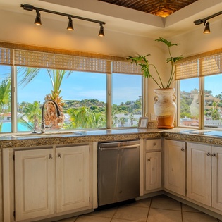 Fully equipped kitchen with large windows
