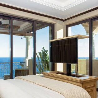 Bedroom suite with access to terrace and ocean views