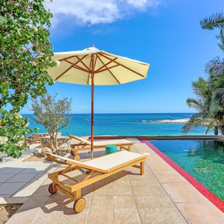 Patio with pool and beach view