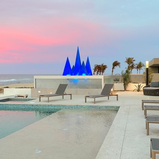 Poolside with ocean views during sunset