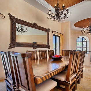 Gather around a grand handcrafted dining table beneath wrought-iron chandeliers and vaulted brick ceilings, where your group can share memorable meals in timeless elegance.