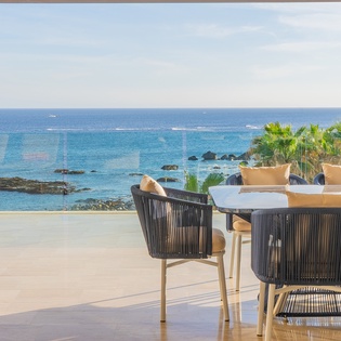 Dine with stunning ocean views from this terrace, where turquoise waters and tropical palms create the perfect backdrop for your meals.