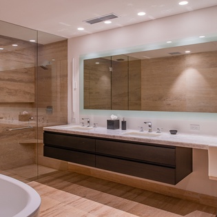 En suite bathroom with walk in shower and bathroom