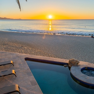 Lounge by the poolside with ocean views