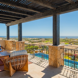 Unwind on your private terrace with stunning ocean views, where comfortable seating awaits your morning coffee or sunset cocktails.