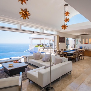 Living room with access to outdoor and ocean view