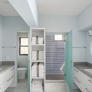 Luxuriate in your spacious bathroom with dual vanities, sleek finishes, and a gorgeous mosaic shower that creates the perfect spa-like retreat.