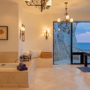 En suite bathroom with bathtub and ocean views