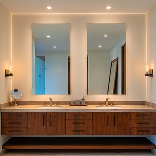 Step into your spa-like ensuite with dual sinks and elegant backlit mirrors—your perfect retreat for morning rituals.