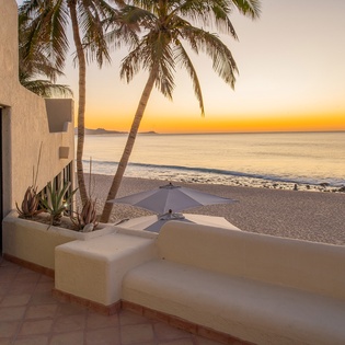 Outdoor seating area with beach access