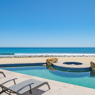 Lounge by the poolside with ocean views