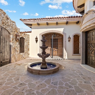 Outdoor entryway with fountain