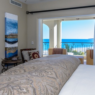 Bedroom suite with balcony and ocean views