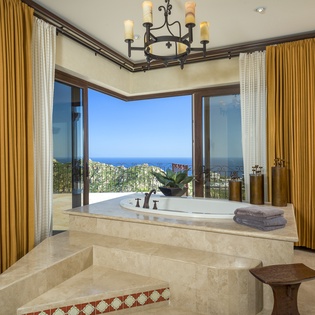 Grand bathroom with ocean views