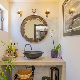 Freshen up in your beautifully appointed bathroom, where natural light, elegant fixtures, and calming touches create a serene morning ritual you'll look forward to each day.
