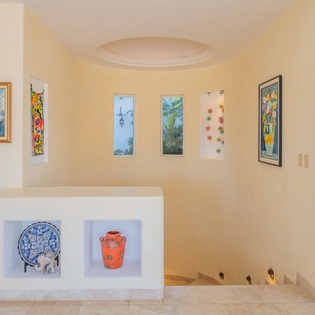 Step into your artistic haven where colorful paintings and thoughtful decor create a warm, inspiring atmosphere throughout your stay.