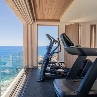 En villa fitness area with ocean views
