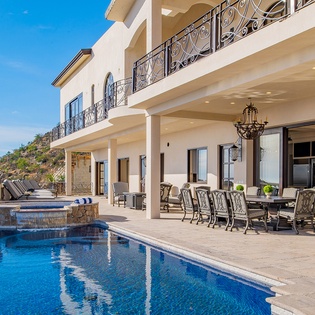 Poolside view of patio and exterior