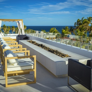 Terrace with firepit and ocean views