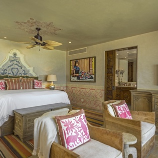 Unwind in your elegantly appointed bedroom with handcrafted furnishings, plush bedding, and authentic décor creating a perfect sanctuary for rest.