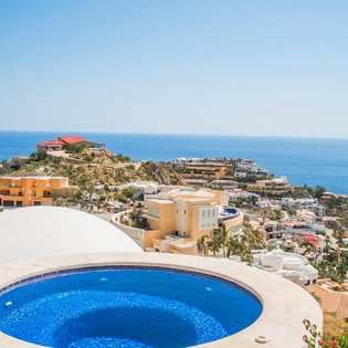 Outdoor patio with jacuzzi and ocean view