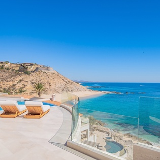 Sunny patio with amazing ocean and beachfront views