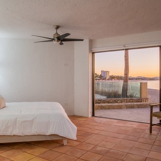 Bedroom suite with patio and beach access