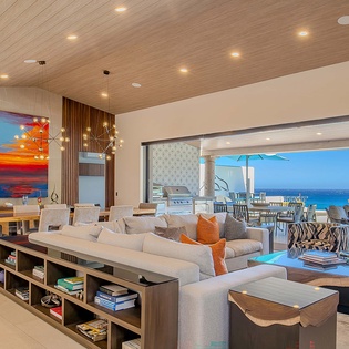 Stunning open-concept living space seamlessly flows to your ocean-view terrace where endless blue horizons await. Natural light floods through floor-to-ceiling glass, perfect for relaxing with morning coffee or sunset cocktails.