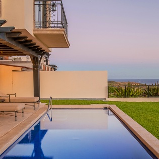 Poolside with ocean view during sunset
