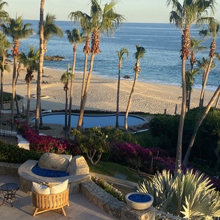 Poolside patio with beachfront views