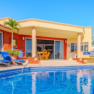 Poolside view of villa exterior