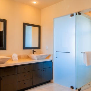 En-suite bathroom with walk-in shower and double sink