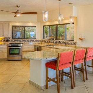 Fully equipped kitchen with bar seating