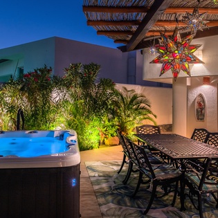 Terrace with outdoor dining and jacuzzi