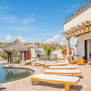 Sunny patio with lounge chairs and amazing views