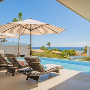Soak up the tropical paradise from your private infinity pool terrace, where ocean views and swaying palms create the perfect retreat.