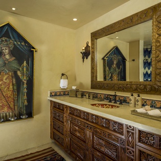 Indulge in your private sanctuary featuring hand-carved vanities, ornate tilework, and stunning artwork that transforms daily routines into luxurious rituals.