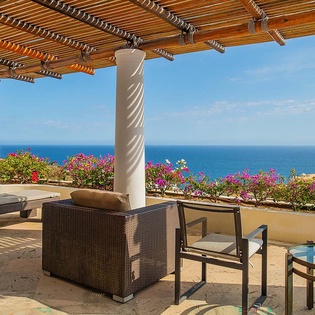 Private terrace with vibrant bougainvillea and endless ocean views—your perfect escape for morning coffee or evening cocktails in complete serenity.