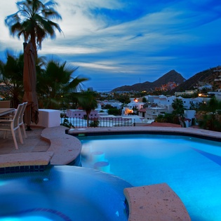 Soak in your private pool as twilight paints the sky, mountains glowing softly in the distance.