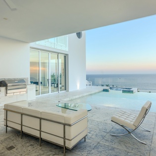 Relax in your private infinity pool with stunning ocean views stretching endlessly before you. Modern luxury meets serene comfort.