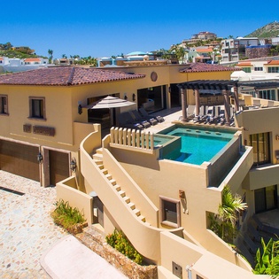Stunning hillside villa with private pool deck and rooftop terrace, set in a tranquil coastal neighborhood with mountain views.