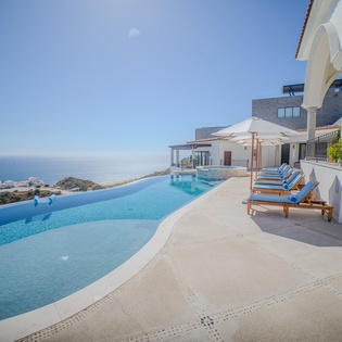 Stunning infinity pool with breathtaking ocean views where you can soak up the sun on comfortable loungers.