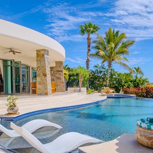 Poolside view of villa exterior