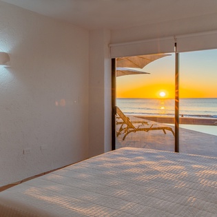 Bedroom suite with patio and beach access