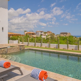 Sunny poolside with lounge