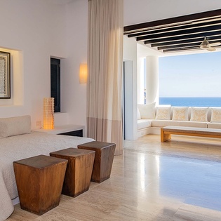 Your spacious sanctuary opens to an airy terrace where endless ocean views await—wake to the gentle sound of waves and sink into sunlit serenity.