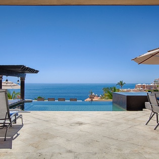 Breathtaking infinity pool overlooking the azure sea. Sink into a lounge chair under the shade, dine al fresco, or grill up a feast while soaking in panoramic ocean views.
